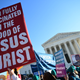 Abortion rights advocates and anti-abortion protesters demonstrate in front of the US Supreme Court in Washington, DC, on December 1, 2021. - The justices weigh whether to uphold a Mississippi law that bans abortion after 15 weeks and overrule the 1973 Roe v. Wade decision. (Photo by Jim WATSON / AFP) (Photo by JIM WATSON/AFP via Getty Images)
